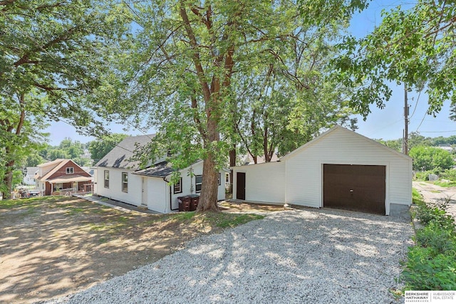 3410 U St, Omaha, NE 68107 - view of front facade featuring gravel driveway and a garage
