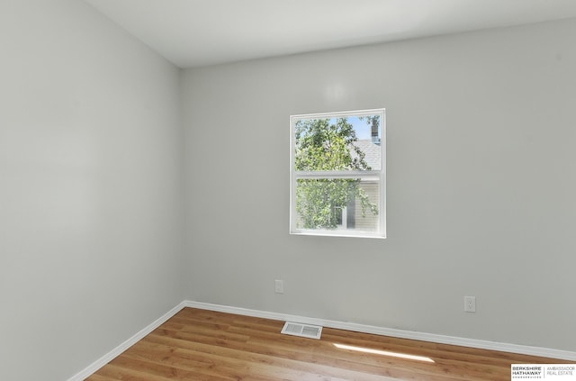 3410 U St, Omaha, NE 68107 - empty room with light wood-style flooring and baseboards