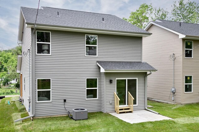 5445 S 51st St, Omaha, NE 68117 - rear view of property with a yard and a shingled roof