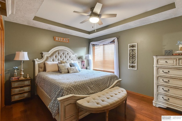 6705 Hillcrest Ln, La Vista, NE 68128 - bedroom featuring a raised ceiling, dark wood-type flooring, and ceiling fan