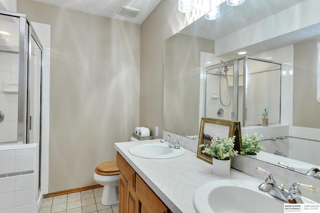 6705 Hillcrest Ln, La Vista, NE 68128 - full bathroom featuring a stall shower, double vanity, and tile patterned flooring