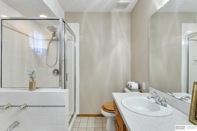 6705 Hillcrest Ln, La Vista, NE 68128 - full bathroom featuring tile patterned floors, vanity, a stall shower, and a textured ceiling