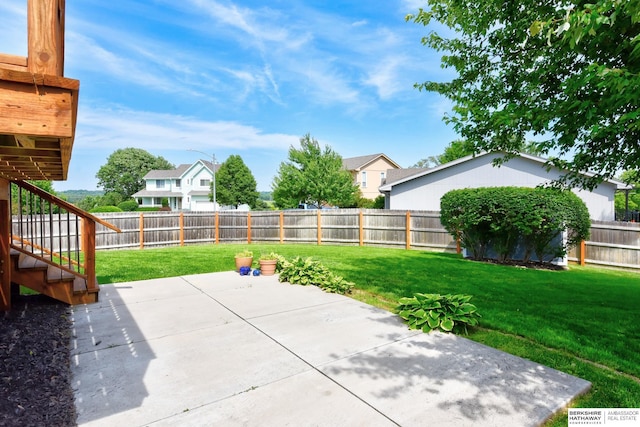 6705 Hillcrest Ln, La Vista, NE 68128 - fenced backyard featuring a patio area, stairs, and a residential view