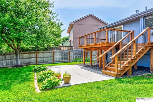 6705 Hillcrest Ln, La Vista, NE 68128 - fenced backyard featuring a patio area, stairs, and a wooden deck