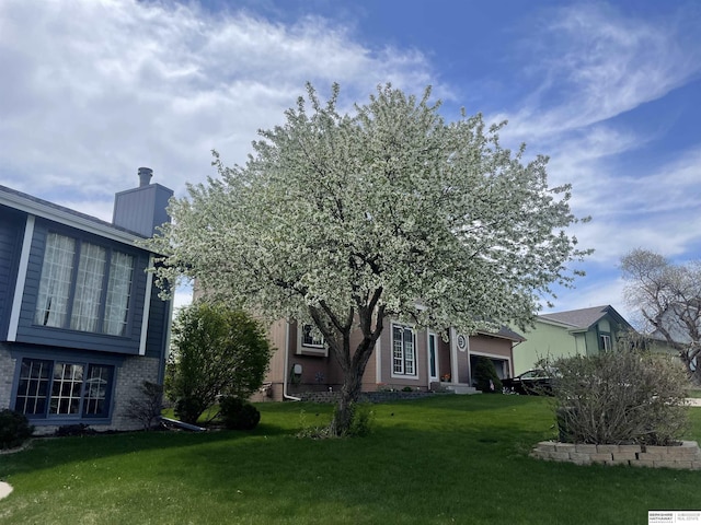 6705 Hillcrest Ln, La Vista, NE 68128 - view of grassy yard featuring an attached garage