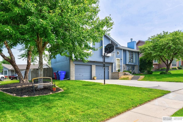 6705 Hillcrest Ln, La Vista, NE 68128 - split foyer home with brick siding, a garage, concrete driveway, and a chimney