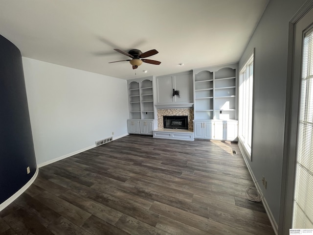 13406 Erskine St, Omaha, NE 68164 - unfurnished living room featuring ceiling fan, a glass covered fireplace, and dark wood-type flooring