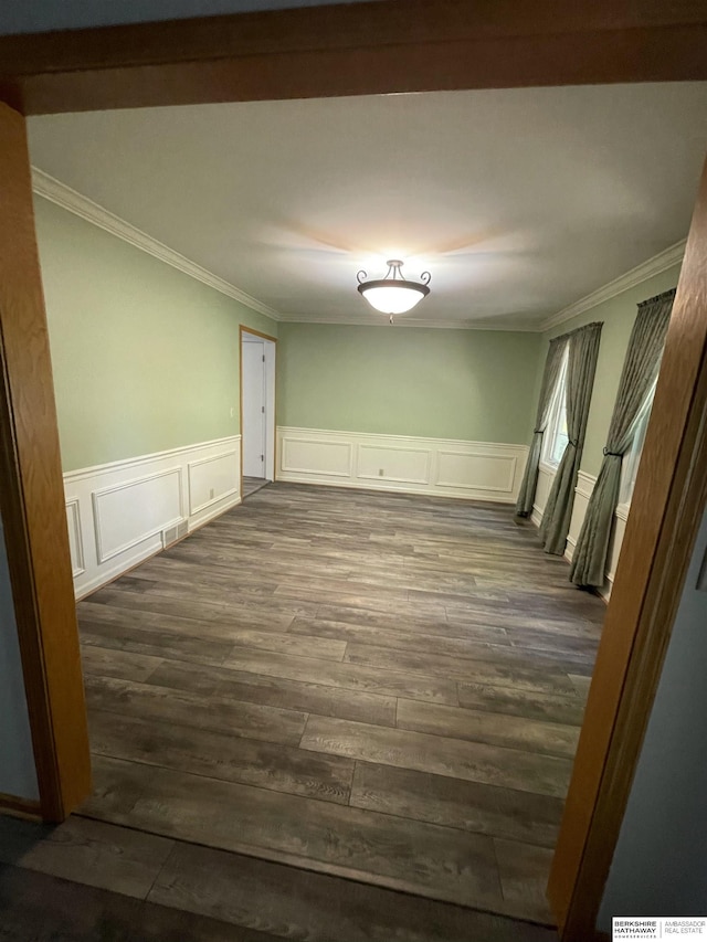 13406 Erskine St, Omaha, NE 68164 - unfurnished dining area with crown molding, dark wood-type flooring, a decorative wall, and wainscoting