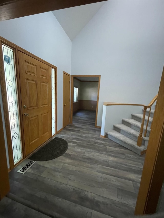 13406 Erskine St, Omaha, NE 68164 - foyer entrance with wood finished floors, high vaulted ceiling, and stairway