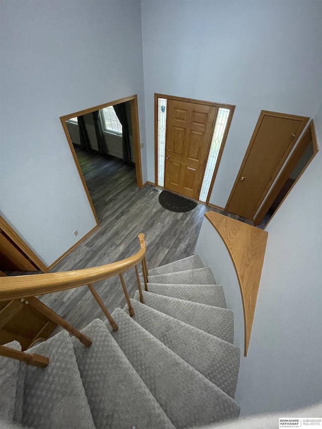 13406 Erskine St, Omaha, NE 68164 - stairway with wood finished floors and a towering ceiling