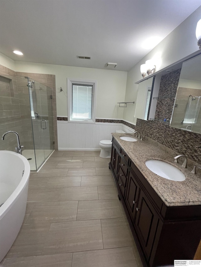 13406 Erskine St, Omaha, NE 68164 - full bathroom featuring a shower stall, a freestanding tub, double vanity, and wainscoting