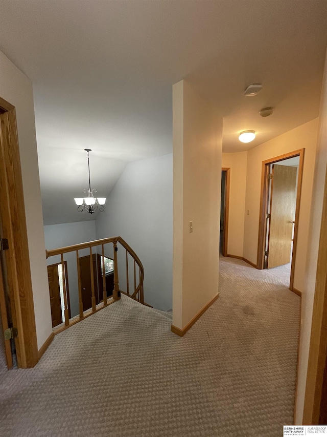 13406 Erskine St, Omaha, NE 68164 - hallway featuring an upstairs landing, carpet floors, a chandelier, and vaulted ceiling