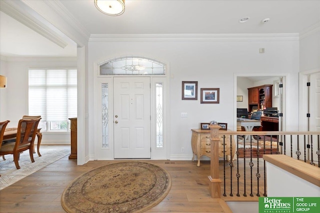 5850 Country Squire Plz, Omaha, NE 68152 - entrance foyer featuring crown molding and hardwood / wood-style flooring