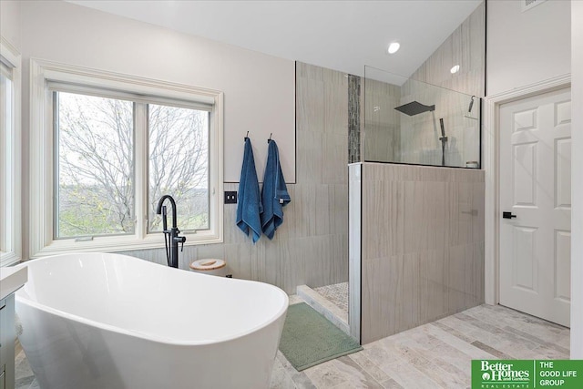 5850 Country Squire Plz, Omaha, NE 68152 - full bathroom with walk in shower, a freestanding tub, and wood finished floors