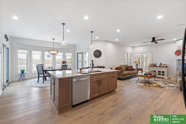 5850 Country Squire Plz, Omaha, NE 68152 - kitchen featuring stainless steel dishwasher, light wood finished floors, open floor plan, an island with sink, and recessed lighting