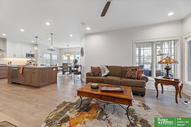 5850 Country Squire Plz, Omaha, NE 68152 - living room with light wood finished floors, recessed lighting, and ceiling fan