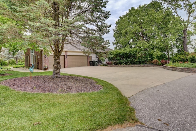 5850 Country Squire Plz, Omaha, NE 68152 - view of property hidden behind natural elements featuring a garage, concrete driveway, brick siding, and a front yard
