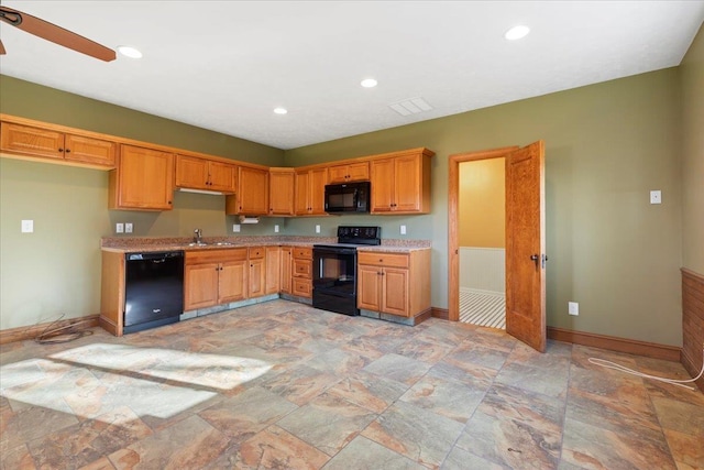 5850 Country Squire Plz, Omaha, NE 68152 - kitchen with black appliances, light stone finish floors, recessed lighting, and ceiling fan