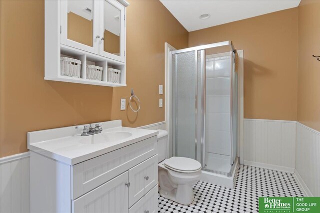 5850 Country Squire Plz, Omaha, NE 68152 - full bathroom featuring a wainscoted wall, a stall shower, and vanity