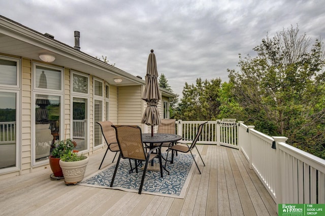 5850 Country Squire Plz, Omaha, NE 68152 - wooden terrace with outdoor dining area