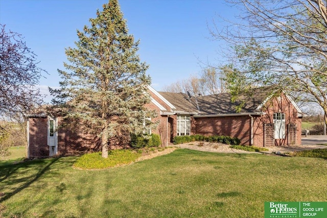 5850 Country Squire Plz, Omaha, NE 68152 - view of front of home featuring a front lawn and brick siding