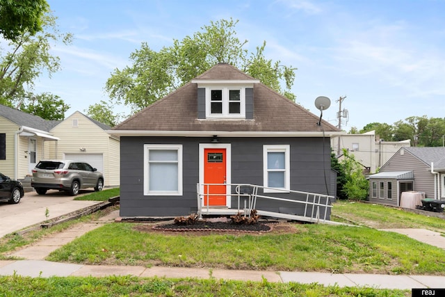 6935 Binney St, Omaha, NE 68104 - view of front facade with a front yard, a porch, and a garage
