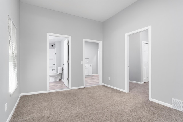 1204 S 27th St, Omaha, NE 68105 - unfurnished bedroom featuring carpet flooring and ensuite bathroom