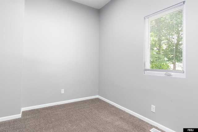 1204 S 27th St, Omaha, NE 68105 - spare room featuring carpet and healthy amount of natural light