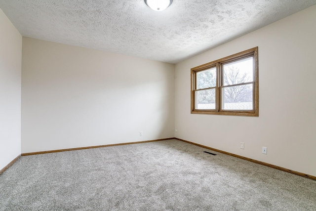 5424 Canterbury Ln Unit 5424, Lincoln, NE 68512 - empty room featuring carpet and a textured ceiling