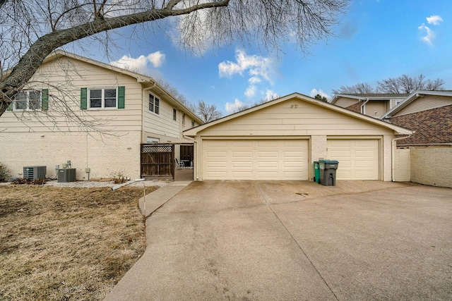 5424 Canterbury Ln Unit 5424, Lincoln, NE 68512 - view of side of property with brick siding and concrete driveway