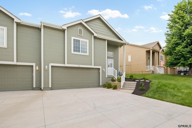 6736 S 191st St, Omaha, NE 68135 - view of front facade with a garage, concrete driveway, and a front lawn