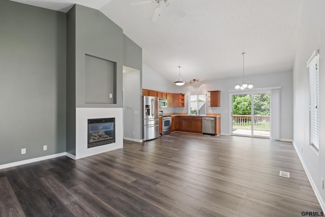 6736 S 191st St, Omaha, NE 68135 - unfurnished living room with a glass covered fireplace, dark wood finished floors, ceiling fan, a chandelier, and high vaulted ceiling