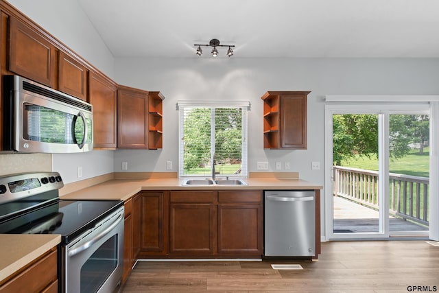 6736 S 191st St, Omaha, NE 68135 - kitchen with stainless steel appliances, open shelves, light countertops, and wood finished floors