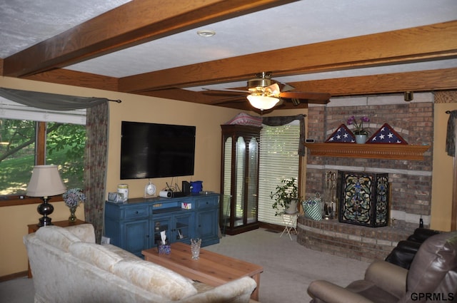 1017 N 129th Cir, Omaha, NE 68154 - living area with plenty of natural light, carpet flooring, a ceiling fan, beam ceiling, and a fireplace