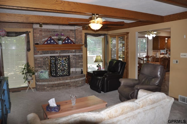 1017 N 129th Cir, Omaha, NE 68154 - living area with carpet floors, a ceiling fan, beamed ceiling, and a brick fireplace