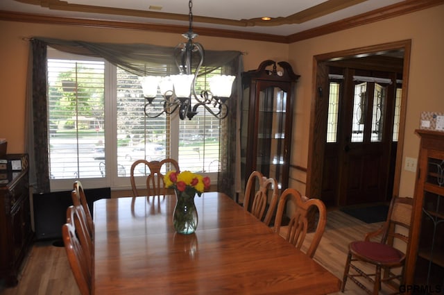 1017 N 129th Cir, Omaha, NE 68154 - dining area with a chandelier, ornamental molding, and wood finished floors