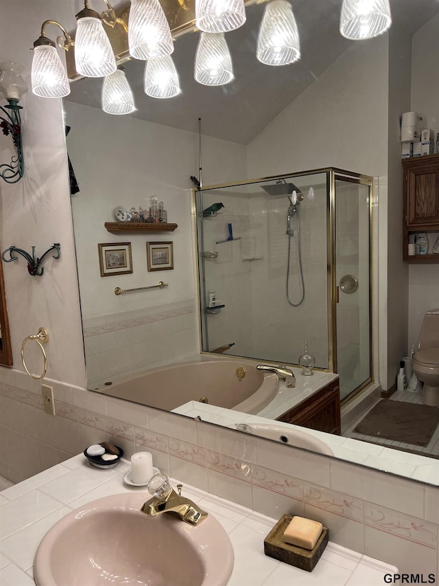 1017 N 129th Cir, Omaha, NE 68154 - bathroom featuring a shower with shower door, a jetted tub, and vaulted ceiling