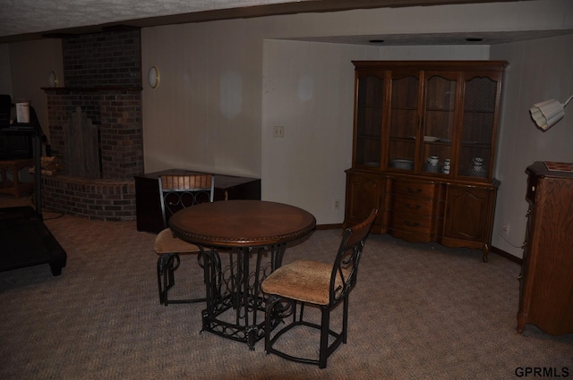 1017 N 129th Cir, Omaha, NE 68154 - carpeted dining space with baseboards and a brick fireplace
