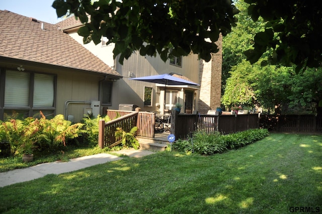1017 N 129th Cir, Omaha, NE 68154 - back of house with roof with shingles and a wooden deck