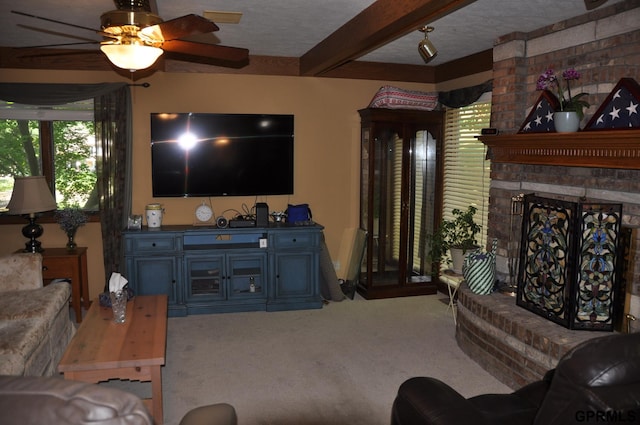 1017 N 129th Cir, Omaha, NE 68154 - carpeted living room with beam ceiling, a brick fireplace, and ceiling fan