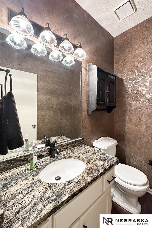 1425 S 158th Cir, Omaha, NE 68130 - bathroom with vanity and a textured ceiling