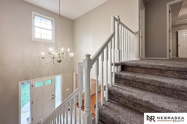 1425 S 158th Cir, Omaha, NE 68130 - carpeted entrance foyer featuring a chandelier and stairs