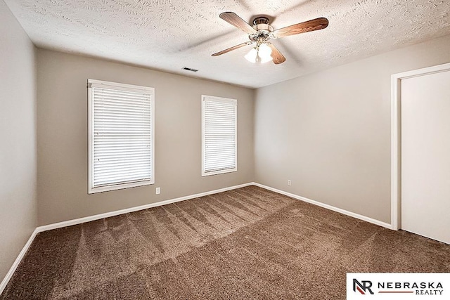 1425 S 158th Cir, Omaha, NE 68130 - carpeted spare room with ceiling fan and a textured ceiling