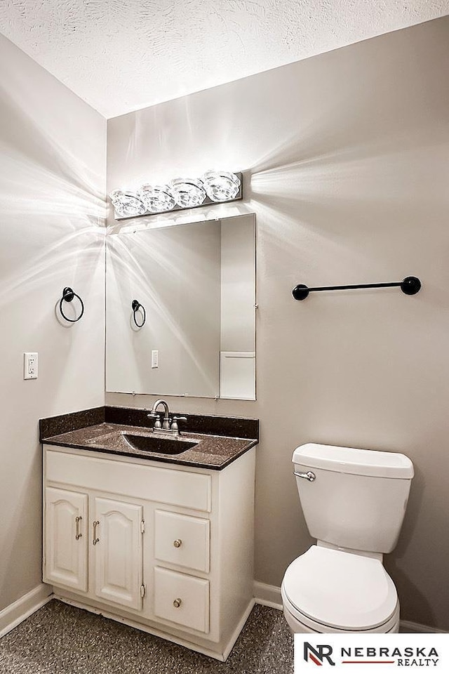 1425 S 158th Cir, Omaha, NE 68130 - bathroom with vanity and a textured ceiling
