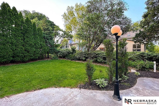 1425 S 158th Cir, Omaha, NE 68130 - view of green lawn featuring a patio