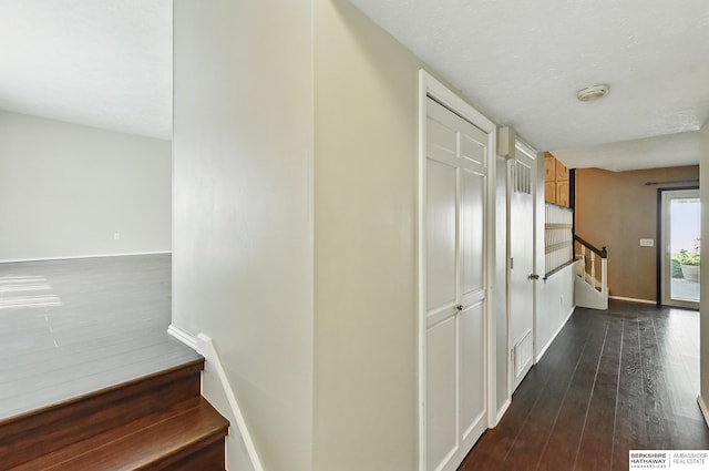 7504 S 46th Ave, Omaha, NE 68157 - hallway featuring stairway and dark wood finished floors
