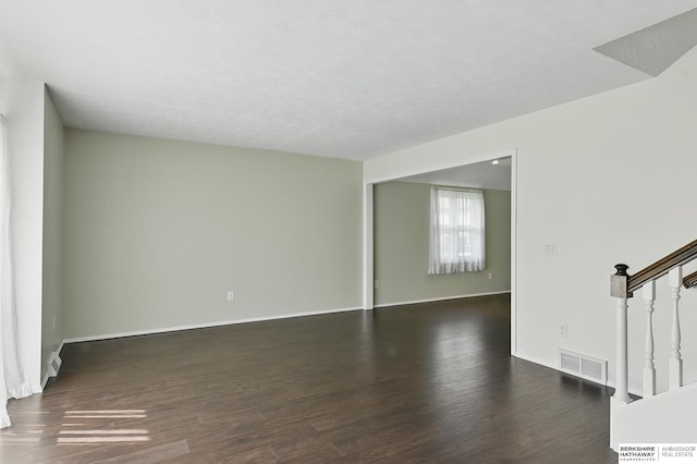 7504 S 46th Ave, Omaha, NE 68157 - spare room featuring stairs and wood finished floors