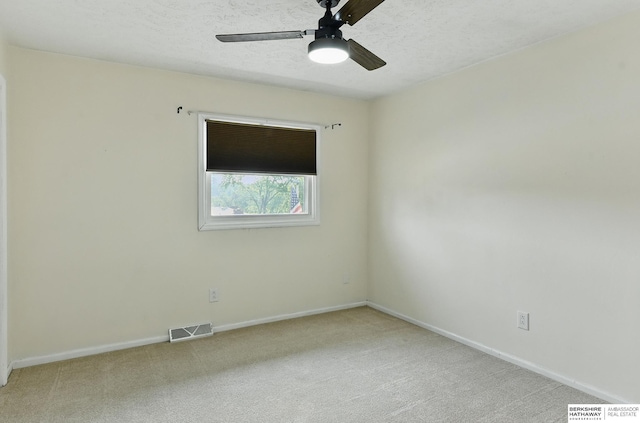 7504 S 46th Ave, Omaha, NE 68157 - empty room featuring a ceiling fan, carpet, and a textured ceiling