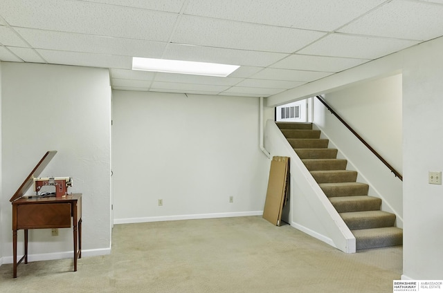 7504 S 46th Ave, Omaha, NE 68157 - finished basement featuring light colored carpet, stairs, and a drop ceiling