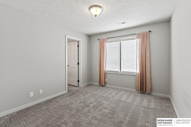 19014 Pratt Cir, Elkhorn, NE 68022 - carpeted spare room featuring a textured ceiling and baseboards